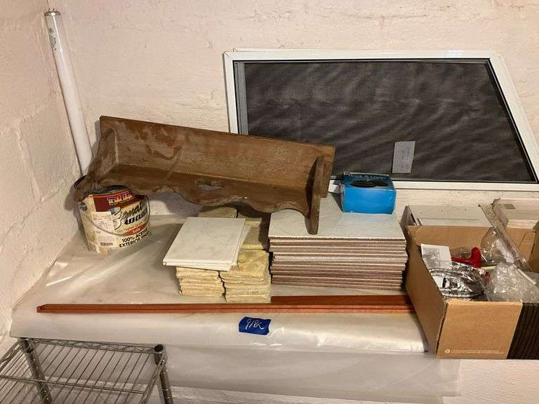 Ceramic tiles, wood bracket shelf, bungee cords, paint rollers, tape, misc