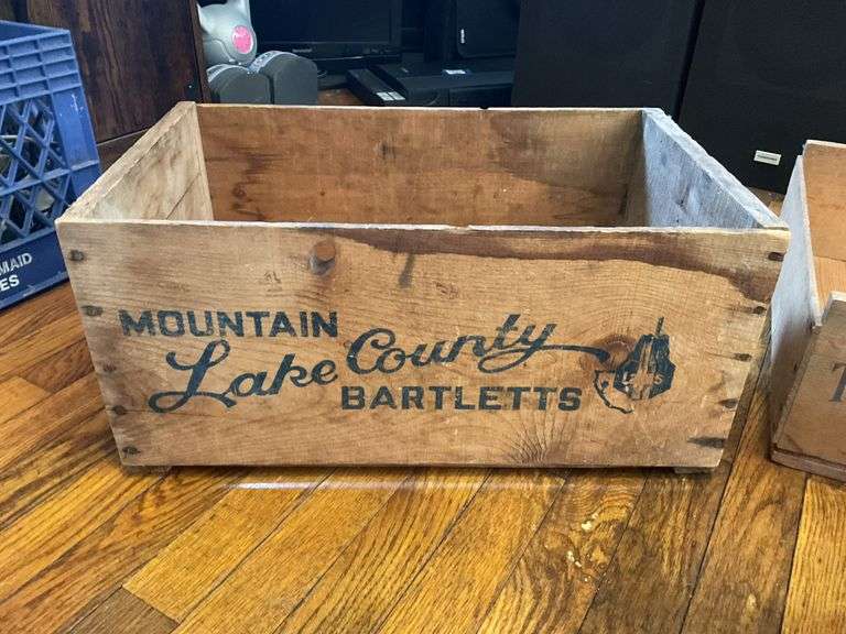 Two wooden advertising fruit crates