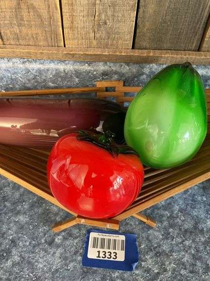 Blown art glass vegetables on wooden basket