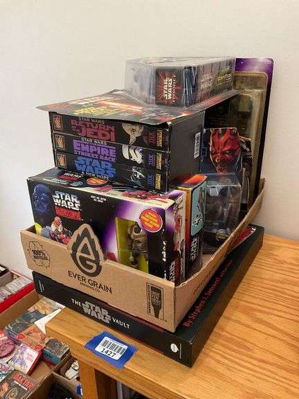 Star Wars collectibles including: VHS tapes, figures, CommTech reader, Darth Vader watch