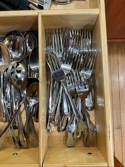 Contents of drawer: flatware, utensils