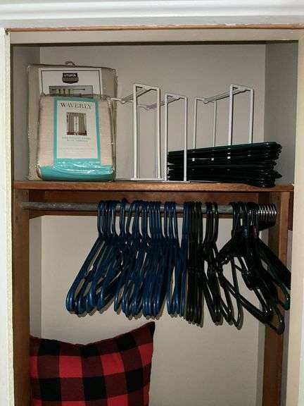 Contents of closet: drapery panels, hangers, throw pillows, comforters