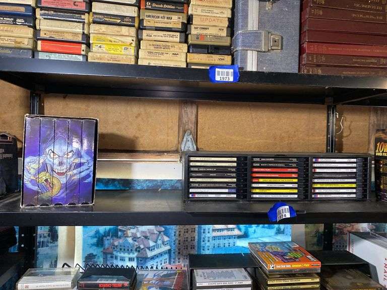 Contents of shelf: Faces of Death VHS box set, music CDs in case