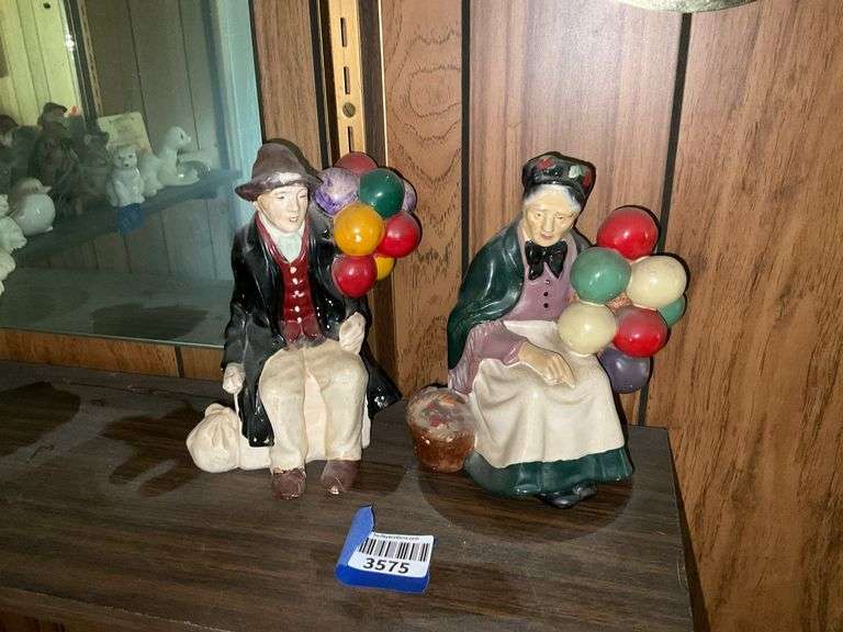 Chalkware balloon seller couple figurines, dated 1952