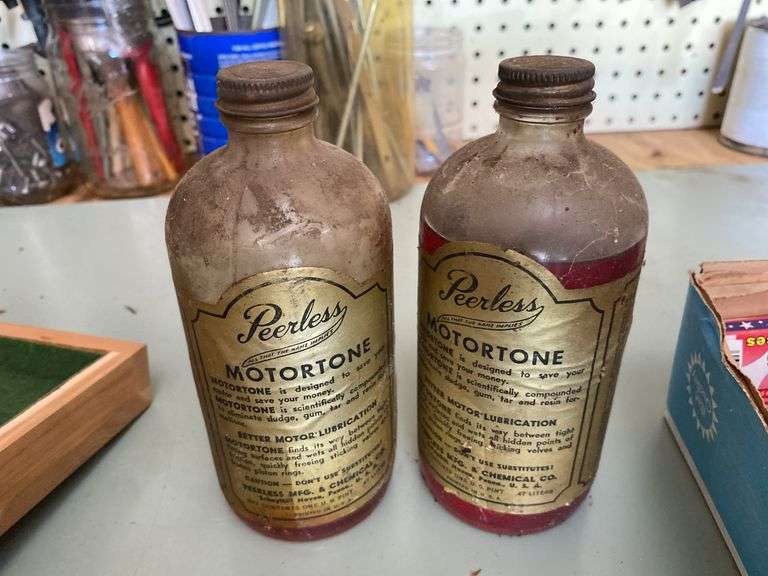 Four Peerless Motortone bottles w/ paper labels