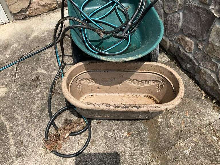 Wheelbarrow, garden hose, planter box, snow shovel