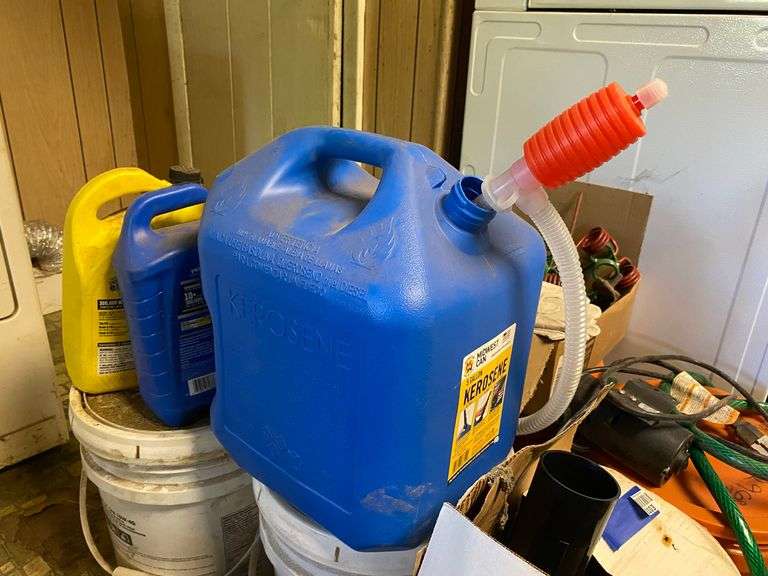 Yard blower in box, plastic kerosene can, antifreeze, motor oil, work gloves, misc