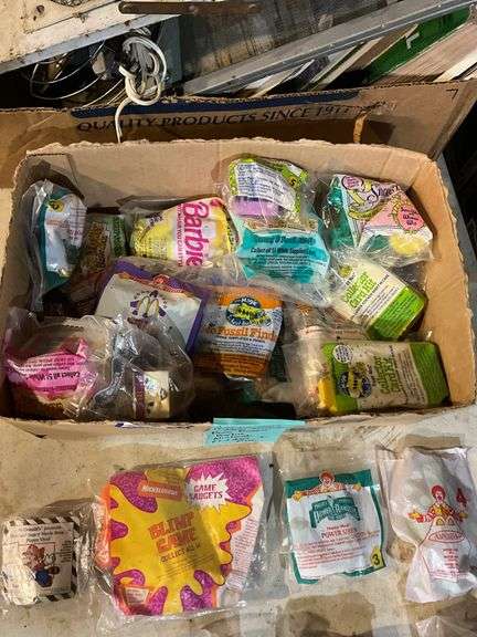 Large lot of vintage Happy Meal toys in packages including: Power Rangers, Flintstones, Barbie, Nintendo