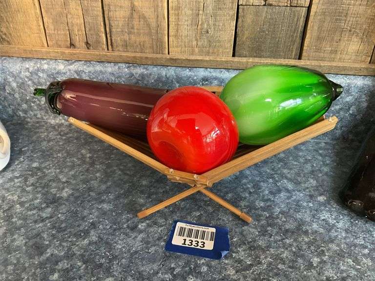 Blown art glass vegetables on wooden basket
