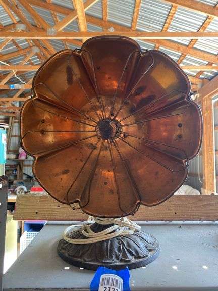 Antique electric heater w/ copper reflector, on cast iron base
