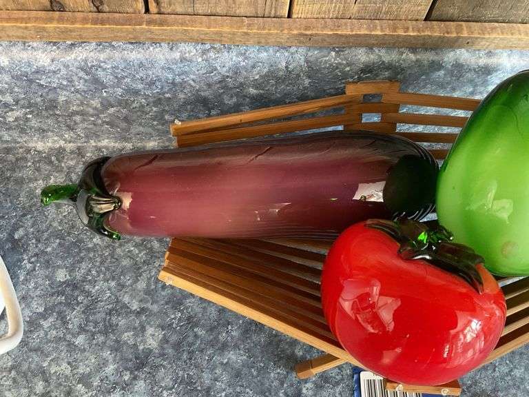 Blown art glass vegetables on wooden basket
