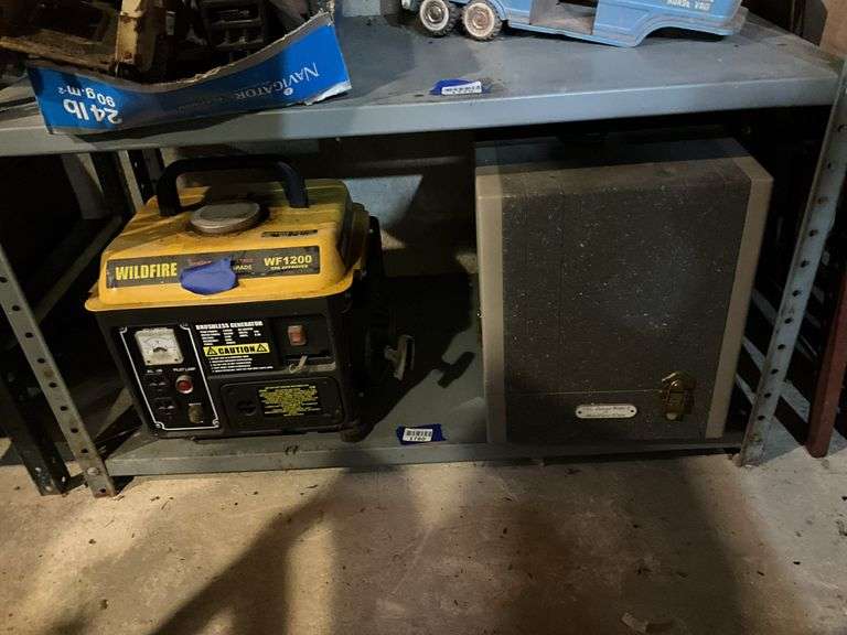 Contents of shelf: Wildfire WF1200 generator, vintage slide projector