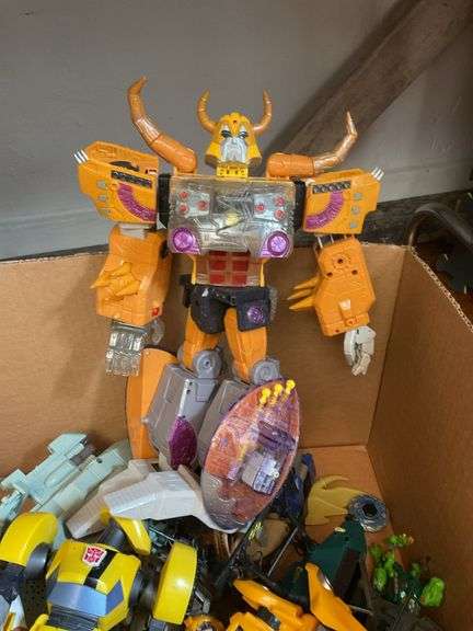Toy lot including: Spider-Man car, WWE Sin Cara action figure, Transformers, misc