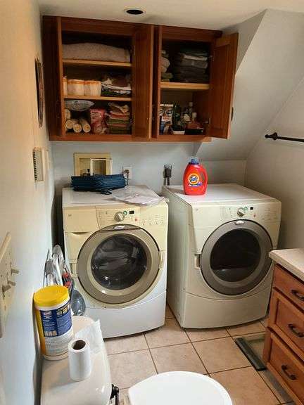 Contents of bath/laundry room: Bath stool, towels, heath & body products, walker, under sink contents, wall plaque, misc. Washer and Dryer NOT FOR SALE.