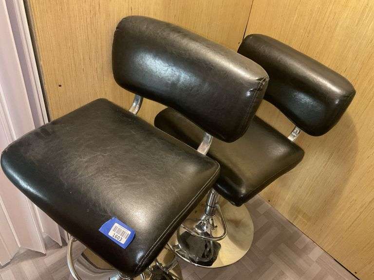 Two chrome and black upholstered bar stools - by the pc take two