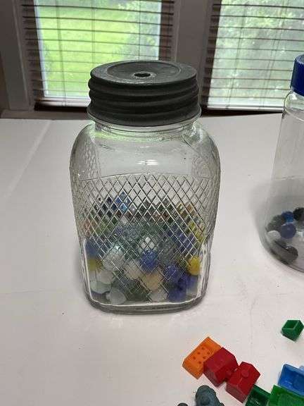 Jars of marbles, dice, and trinkets