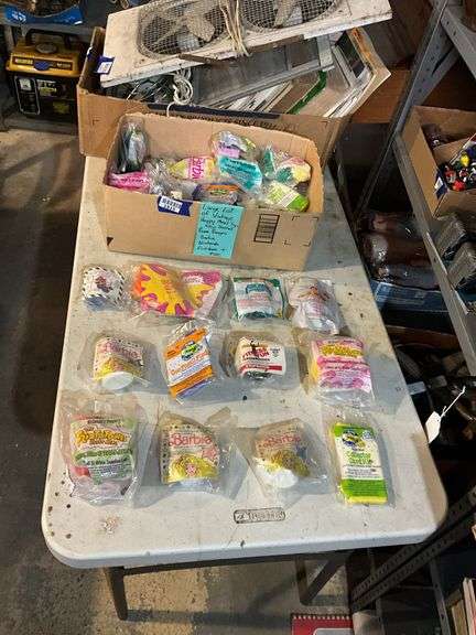 Large lot of vintage Happy Meal toys in packages including: Power Rangers, Flintstones, Barbie, Nintendo