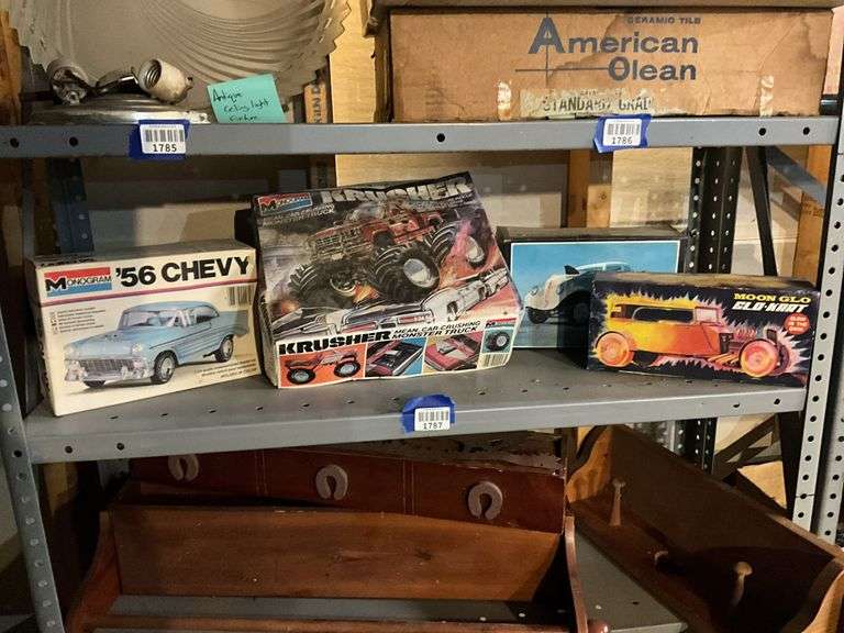 Contents of shelf: vintage car/truck model kits in boxes
