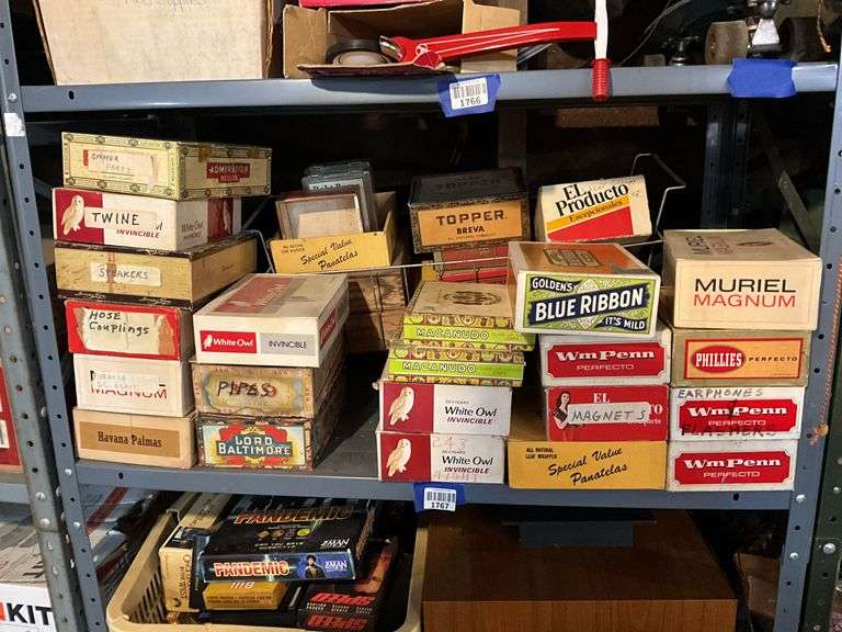 Contents of shelf: vintage cigar boxes