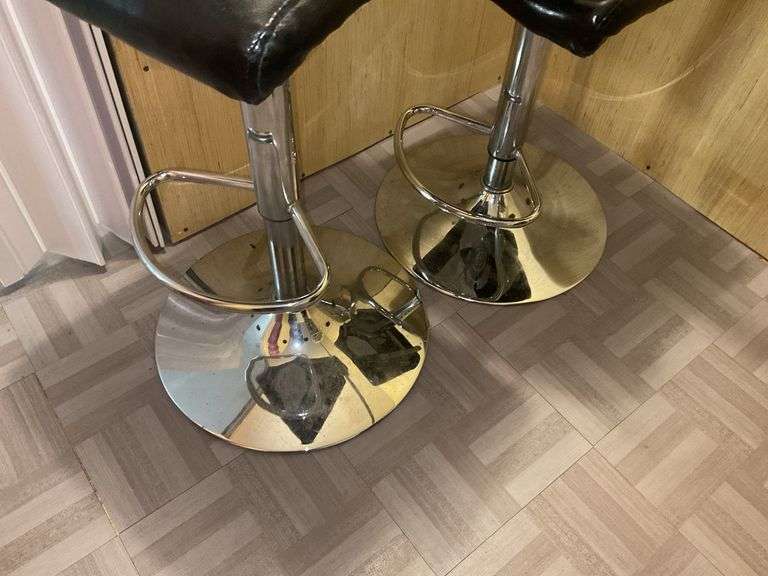 Two chrome and black upholstered bar stools - by the pc take two
