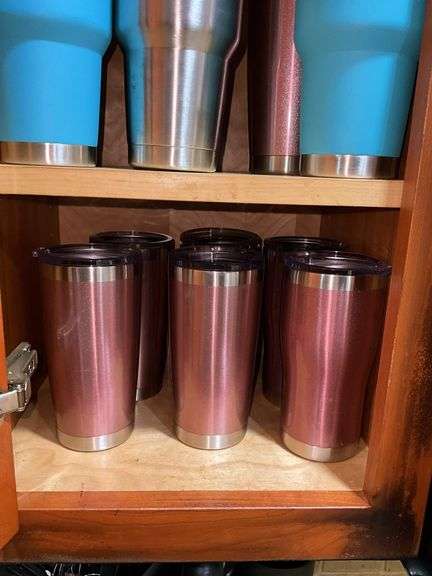 Contents of cupboard: travel mugs/tumblers