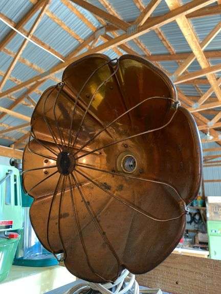 Antique electric heater w/ copper reflector, on cast iron base
