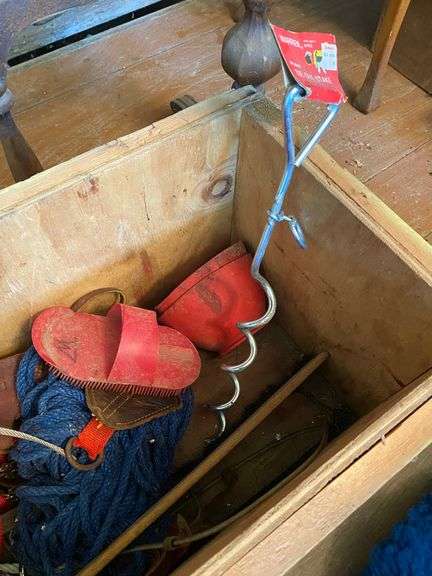 Horse tack in wooden crate