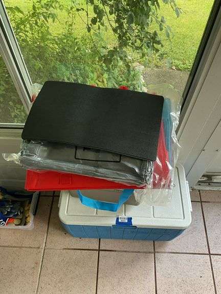 Two Coleman coolers and tote bags