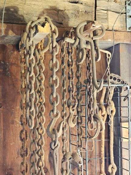 Tow chains, hay bale hook, misc