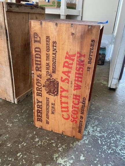 Two wooden advertising crates: Life Pears and Cutty Sark Whisky