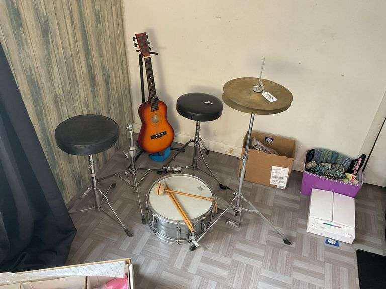 Snare drum, hi-hat cymbal, First Act guitar, two stools