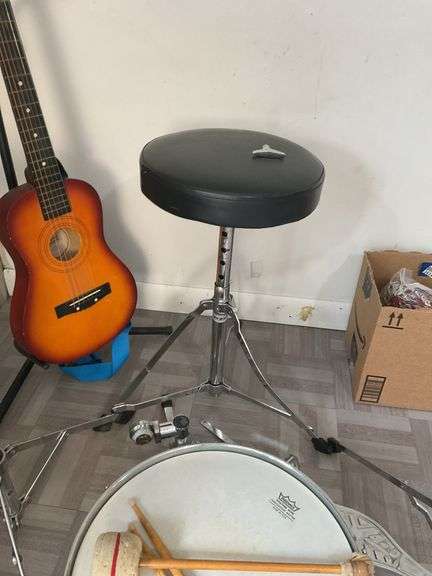 Snare drum, hi-hat cymbal, First Act guitar, two stools