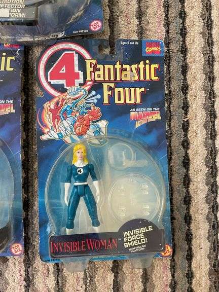 Three Fantastic Four action figures in packages