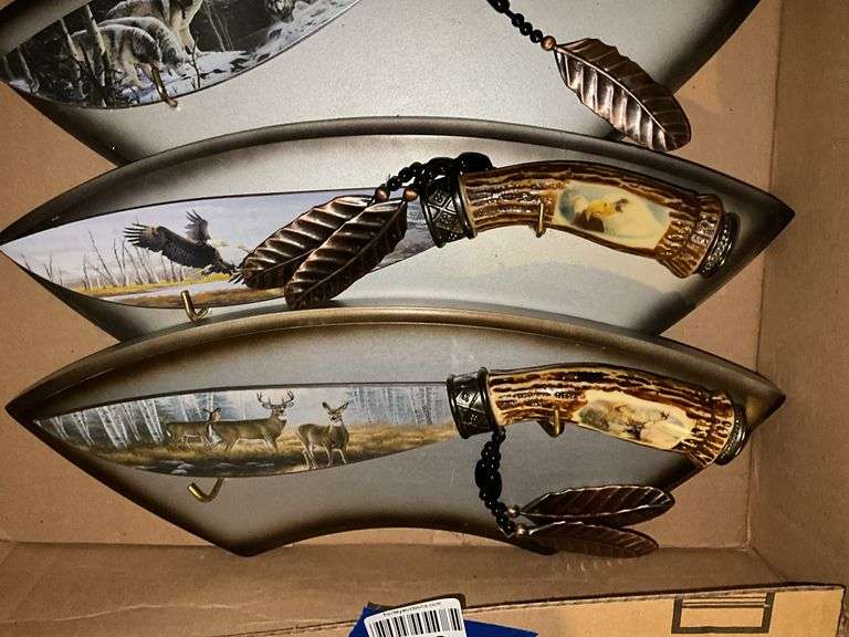 Three decorated wildlife knives/plaques