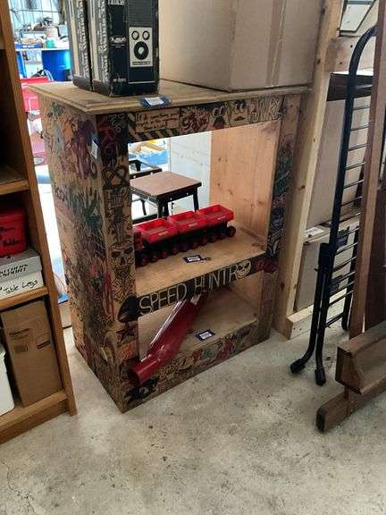 Wooden shelf unit covered w/ drawings - no contents 27.5x37x16.5