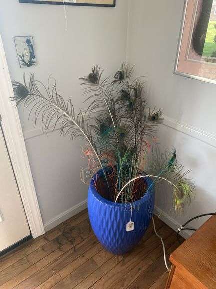 Blue glazed planter pot w/ peacock feather contents