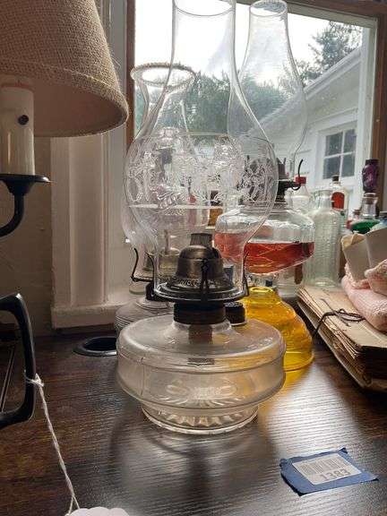 Three glass oil lamps w/ burners and chimneys