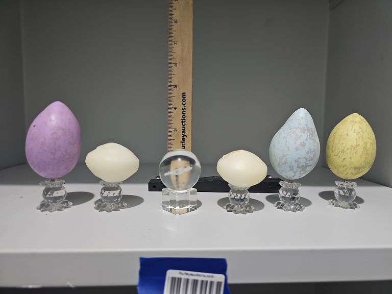 Contents of shelf: glass sphere w/ etched crab, Swarovski crystal pin candleholders w/ decorative eggs