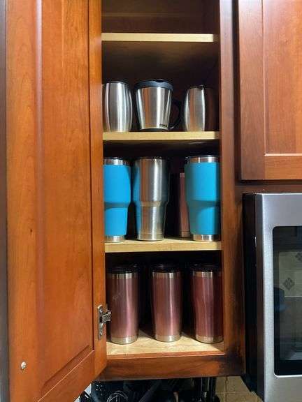 Contents of cupboard: travel mugs/tumblers