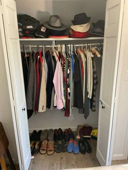 Contents of closet: men's, women's clothing, various sizes, 7 1/2 shoe size, and shoeshine kit