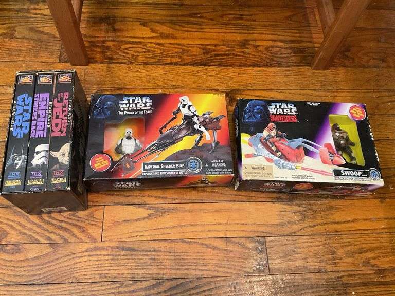 Star Wars collectibles including: VHS tapes, figures, CommTech reader, Darth Vader watch