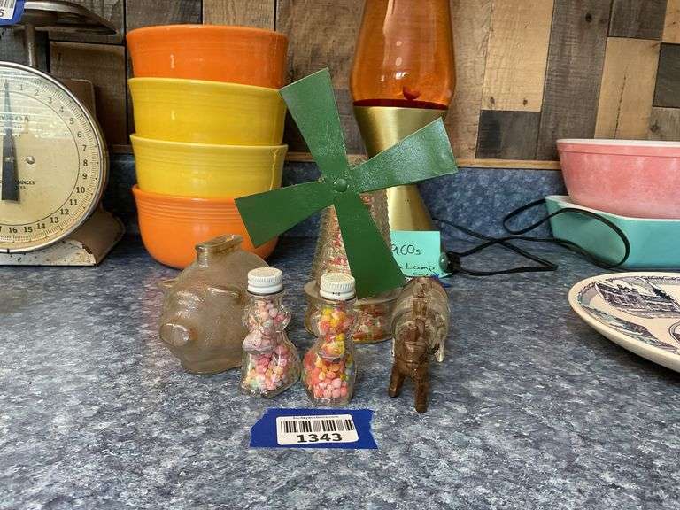 Glass piggy bank and four figural glass candy containers - note damage to barrel wagon