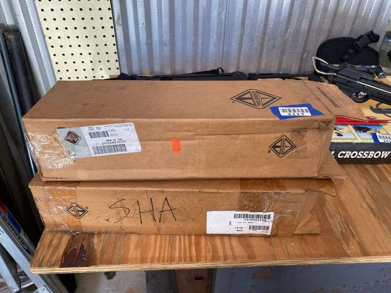 Two International arm rests in boxes