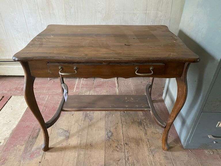 Turn-of-the-century library table w/ drawer in apron, sawn cabriole legs. Contents of drawer included  36x24x29