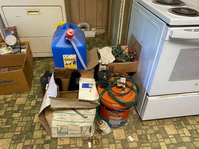 Yard blower in box, plastic kerosene can, antifreeze, motor oil, work gloves, misc