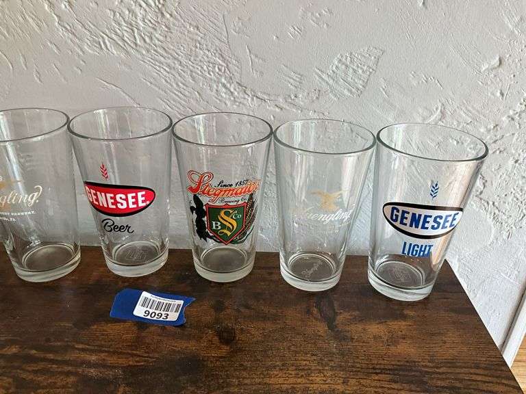 Seven advertising beer glasses