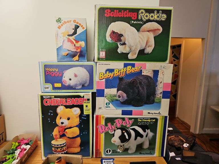 Wind-up and battery op toys in boxes including: Mother Goose, dog, pig, bears, calf