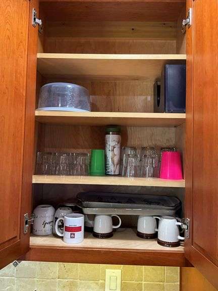Contents of two cupboards: mugs, glasses, stemware, Halloween bowls, misc