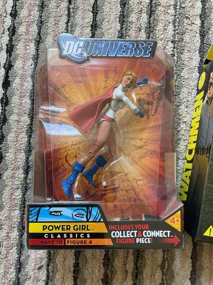 Two action figures in packages: Power Girl and Nite Owl