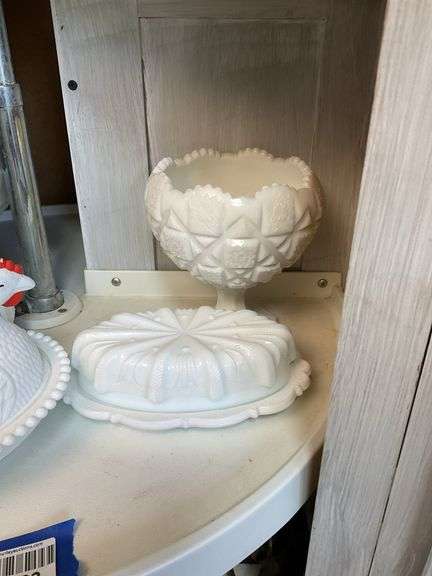 Contents of shelf: milk glass hen on nest, swung vase, compote, butter dish, grape vase, lamp base
